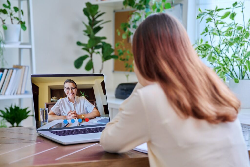 A virtual financial planning meets a client in a video call.