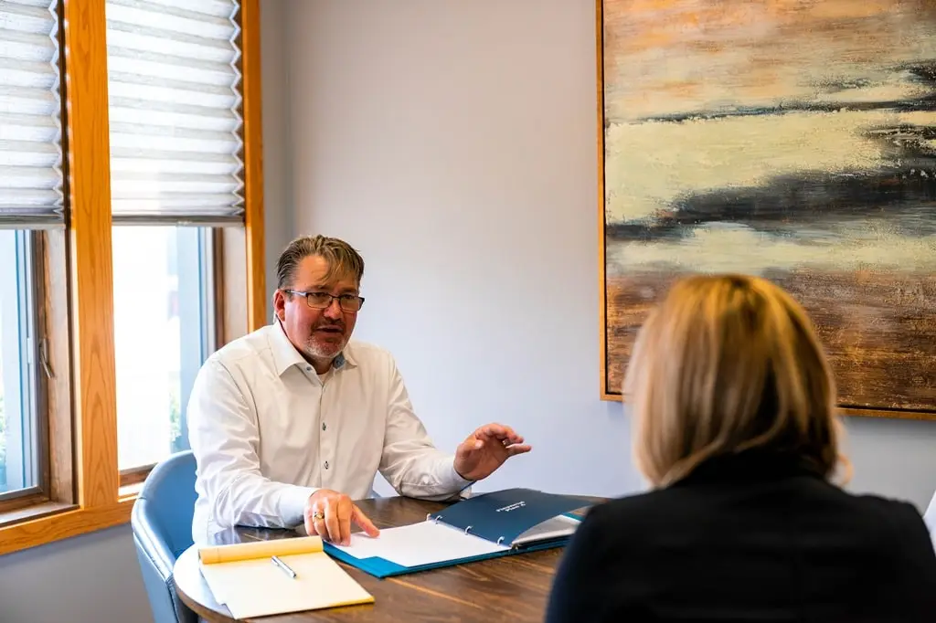 A financial advisor discusses a financial plan with a customer.